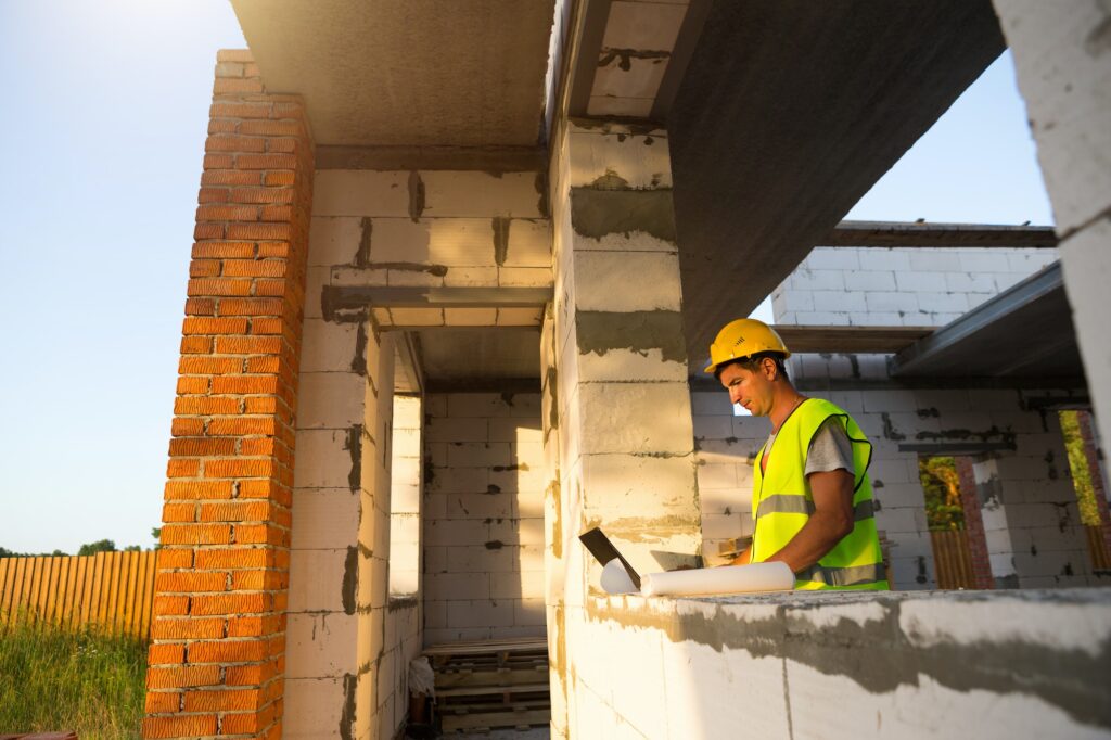 Construction engineer on the construction site of a house